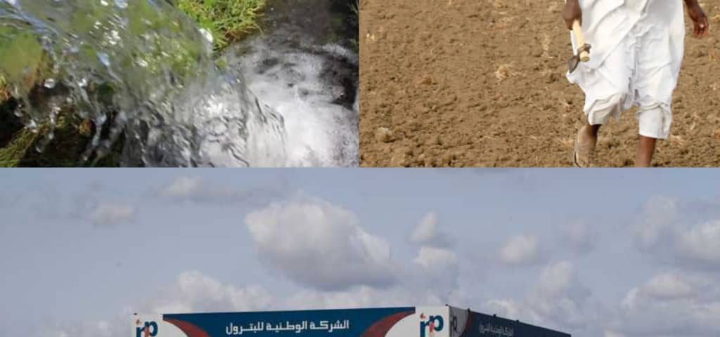 A gas station in Sudan with pictures of farmers in their fields